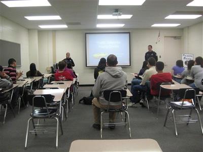 Traffic Unit teaches a Palatine High School class about roadway safety.