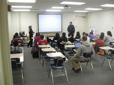 Traffic Unit teaches a Palatine High School class about roadway safety.