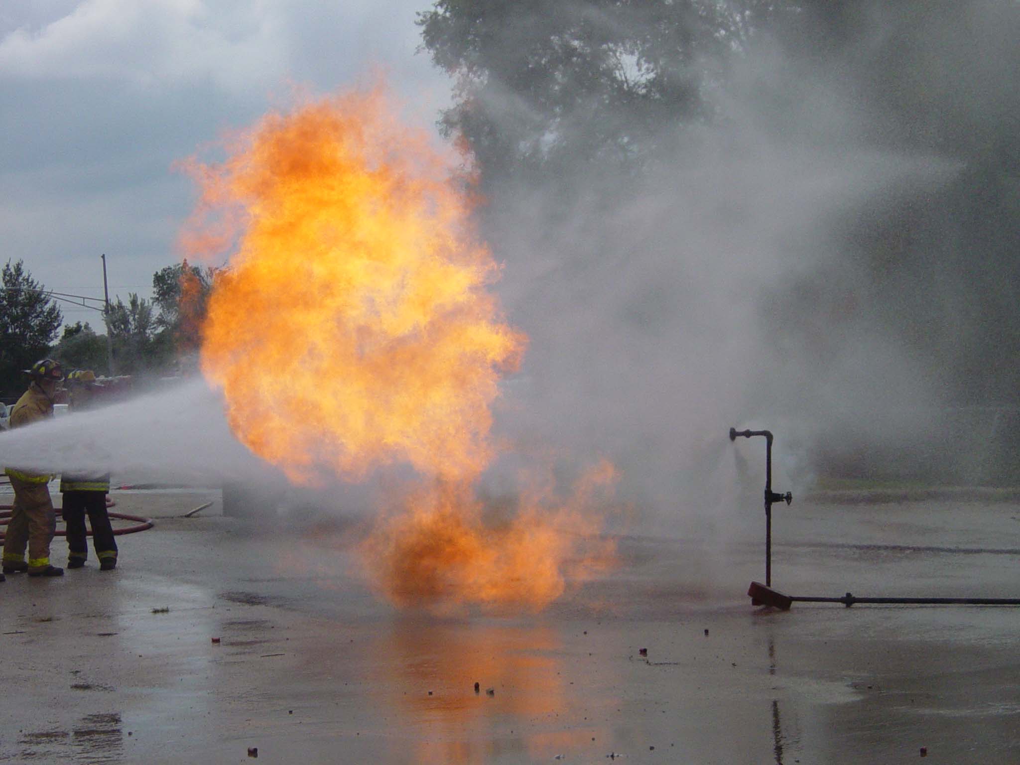 Fire crews attack a propane fire at a practical training drill taught by the Illinois Fire Service I