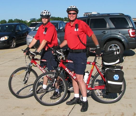 Palatine Fire Department Bike Team members stand by at triathlon.