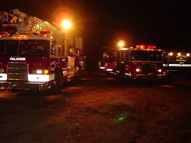 Palatine Fire Department apparatus light up the scene at a night training drill.